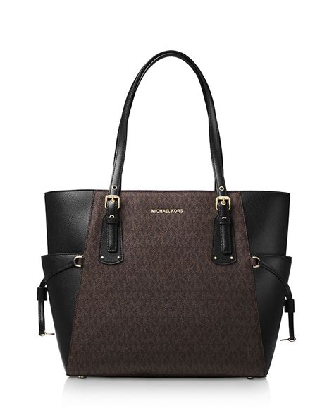 michael michael kors jacquard signature voyager east west tote|Michael Kors voyager tote merlot.